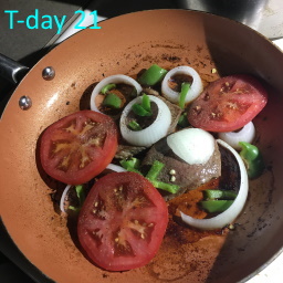 steak tomato onion in skillet