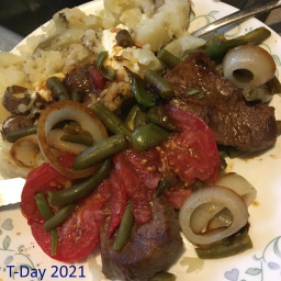 steak tomato onion in skillet